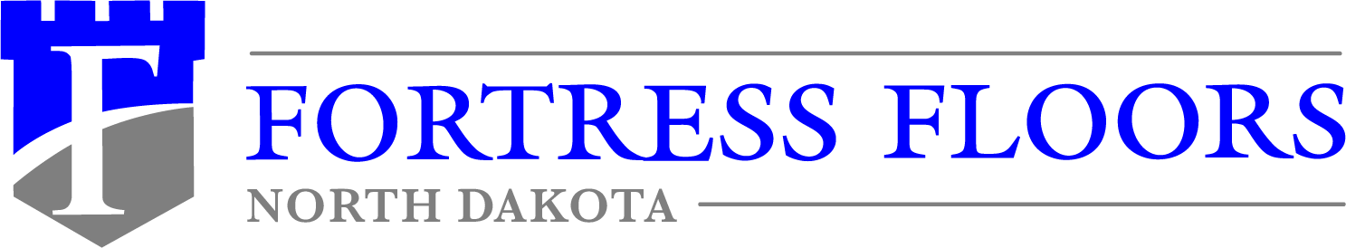 A logo featuring the text "Fortress Floors North Dakota" with a stylized blue and gray castle tower design to the left.