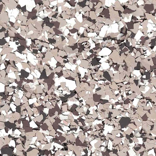 A textured surface featuring a mix of beige, brown, black, and white flakes, resembling a decorative speckled pattern often used on floors.